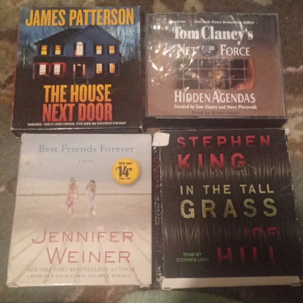 Set Of 4 New Audiobooks (worn out covers with brand new discs)